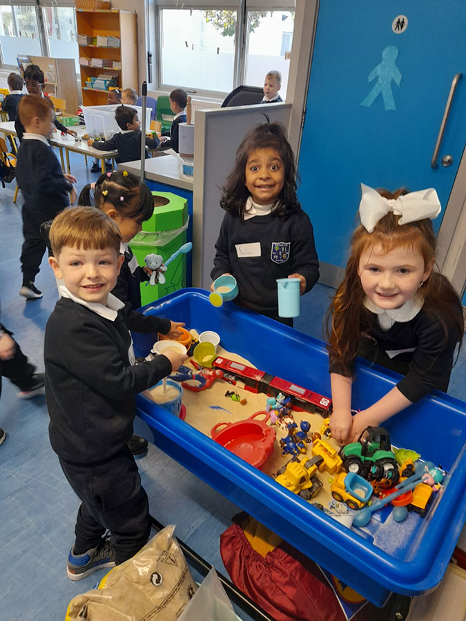 Junior Infants children working together in classroom